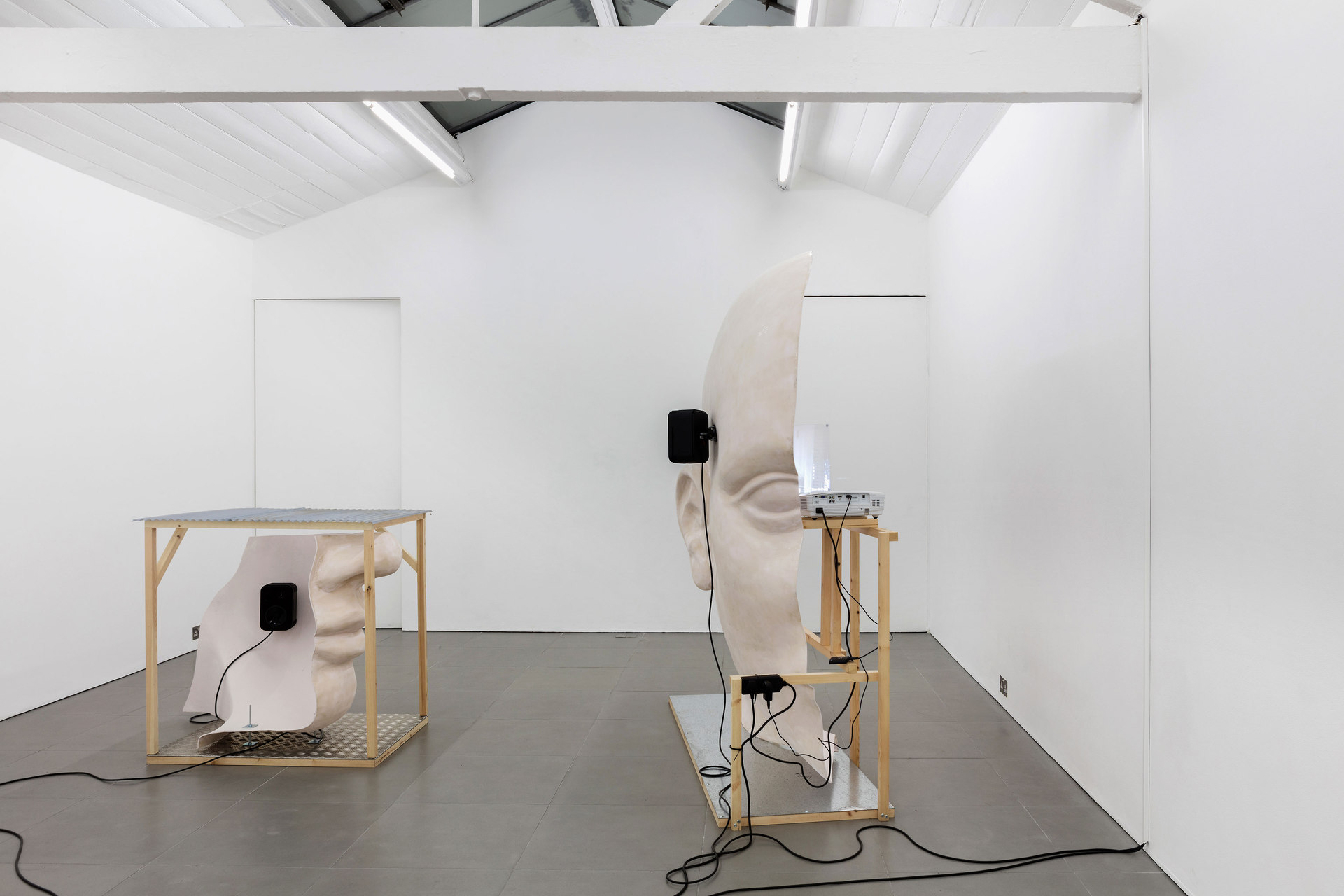 Anne de Vries, Submission, 2015, fibre glass resin, wood, perspex, metal, live stream webcams, four channel audio track: 16 mins 25 secs, dimensions variable. Cell Project Space