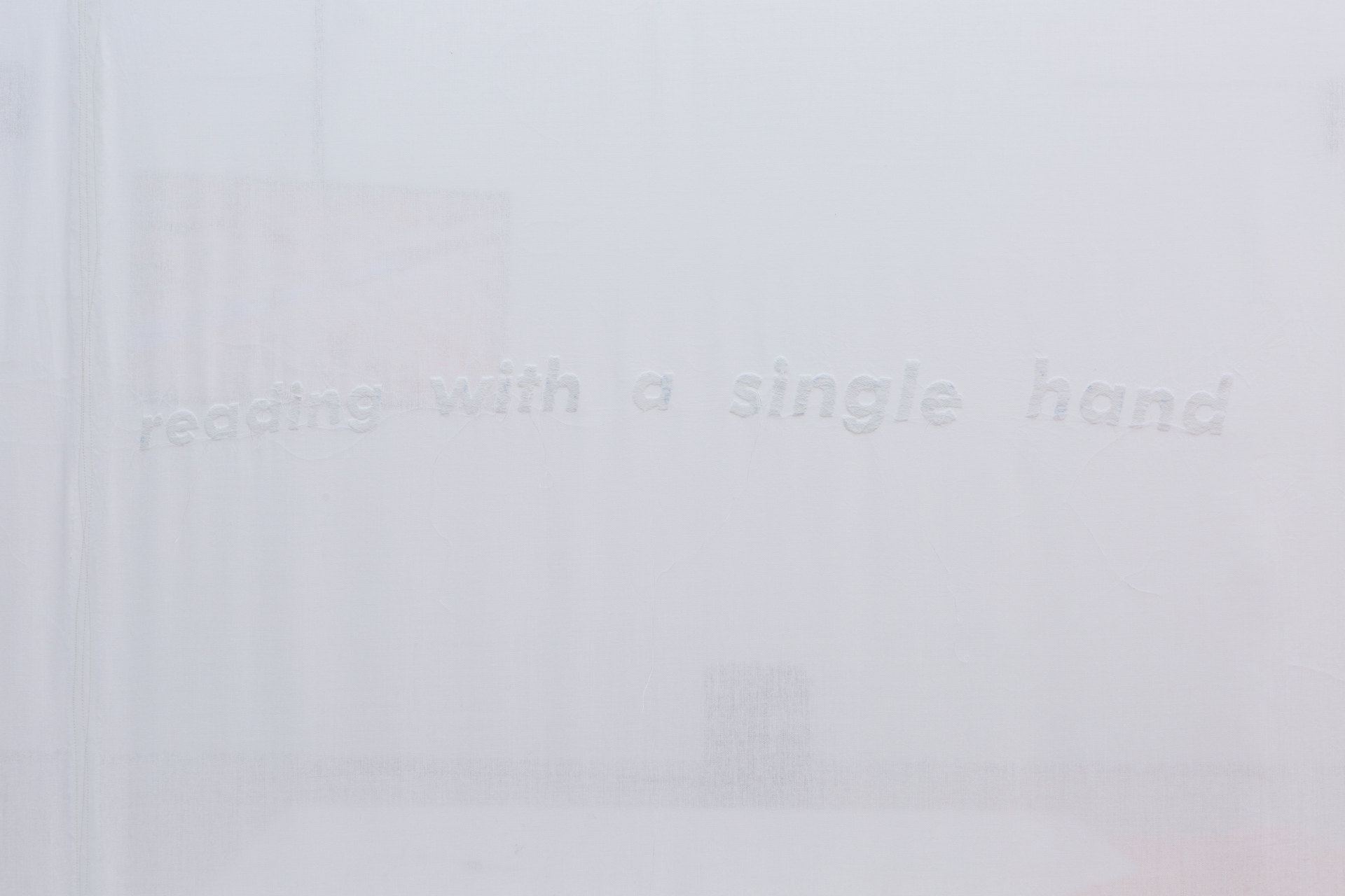 YGRG14X reading with the single hand, 2018, Installation View (Detail) Video, handmade carpet, Conipur Pro clay dust, handmade curtain, chroma sand Dimensions variable