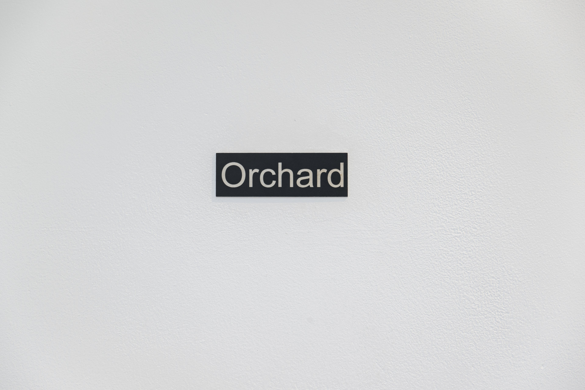Orchard Door Sign, 2005, vinyl, plastic, 2.5 x 7.5 cm, Orchard Documents, Cell Project Space, 2026
