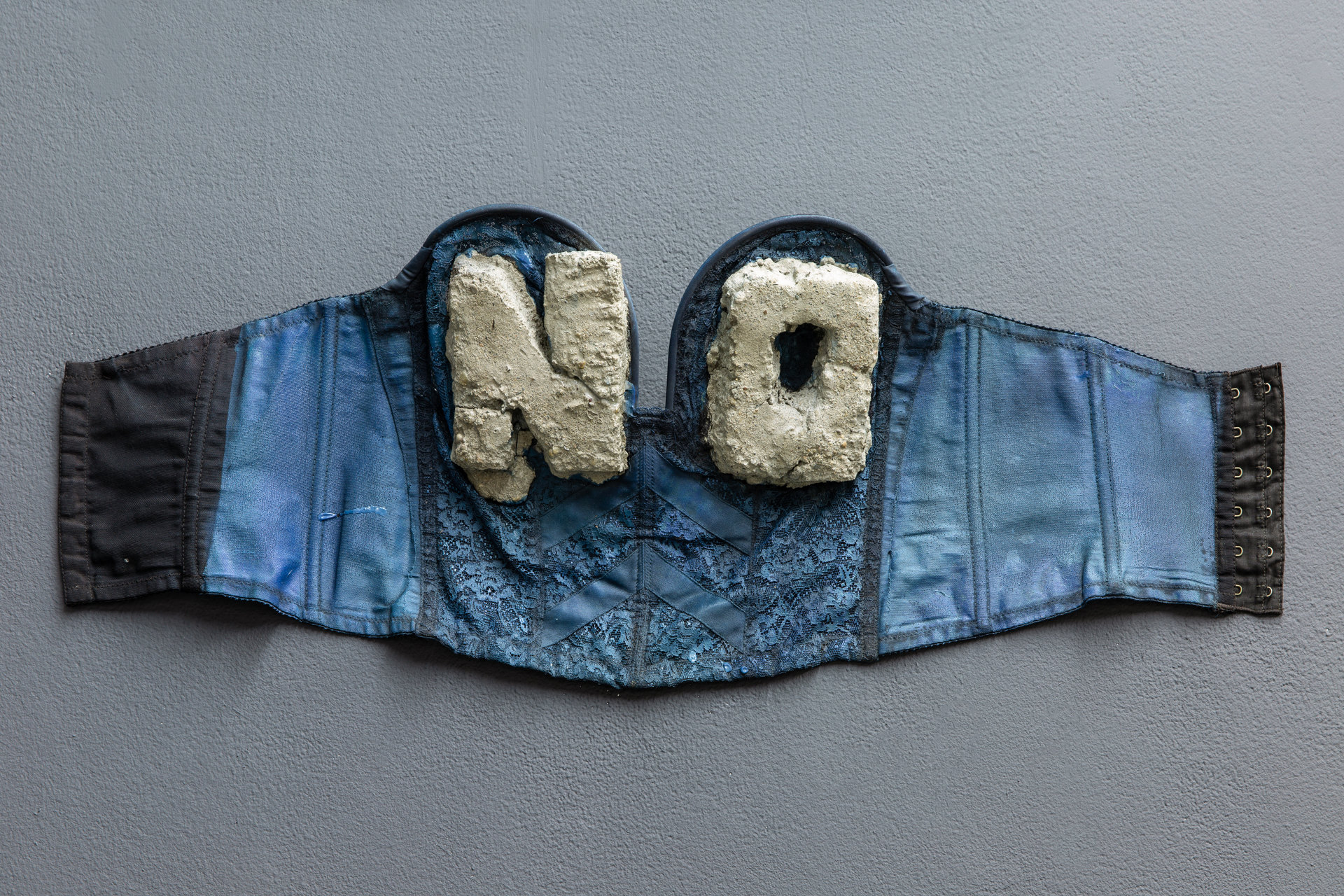 Boris Lurie, 'NO Bra (NOs cast in cement)', c. 1972–1974, Shit and Doom - NO!art, 2019 Boris Lurie, 'NO Bra (NOs cast in cement)', c. 1972–1974, Bra with concrete, 37 x 79 x 6cm, Shit and Doom - NO!art, 2019, Cell Project Space