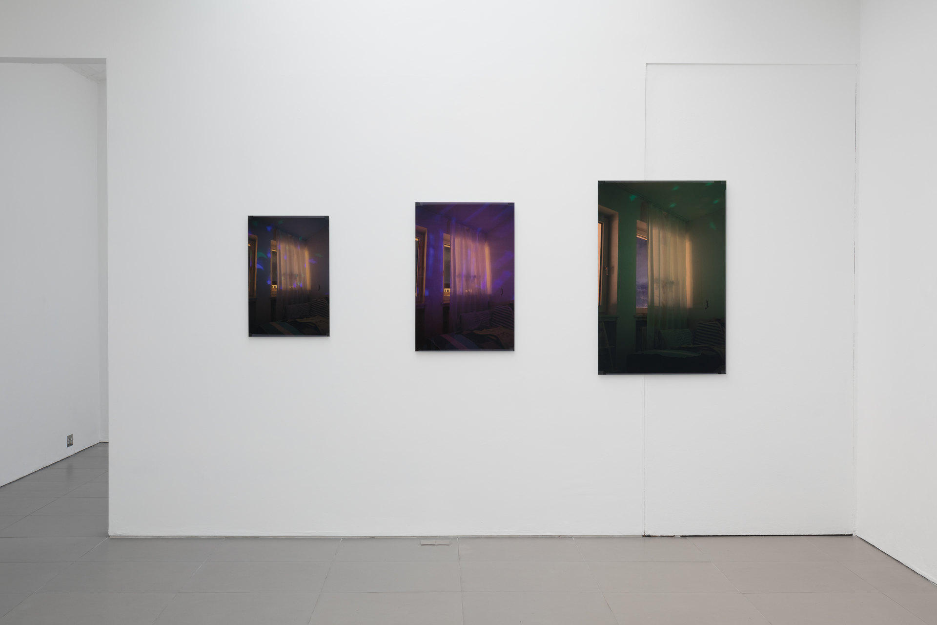 Niklas Taleb, Untitled, installation view, 2023, archival pigment print, artist frame; glass, tape