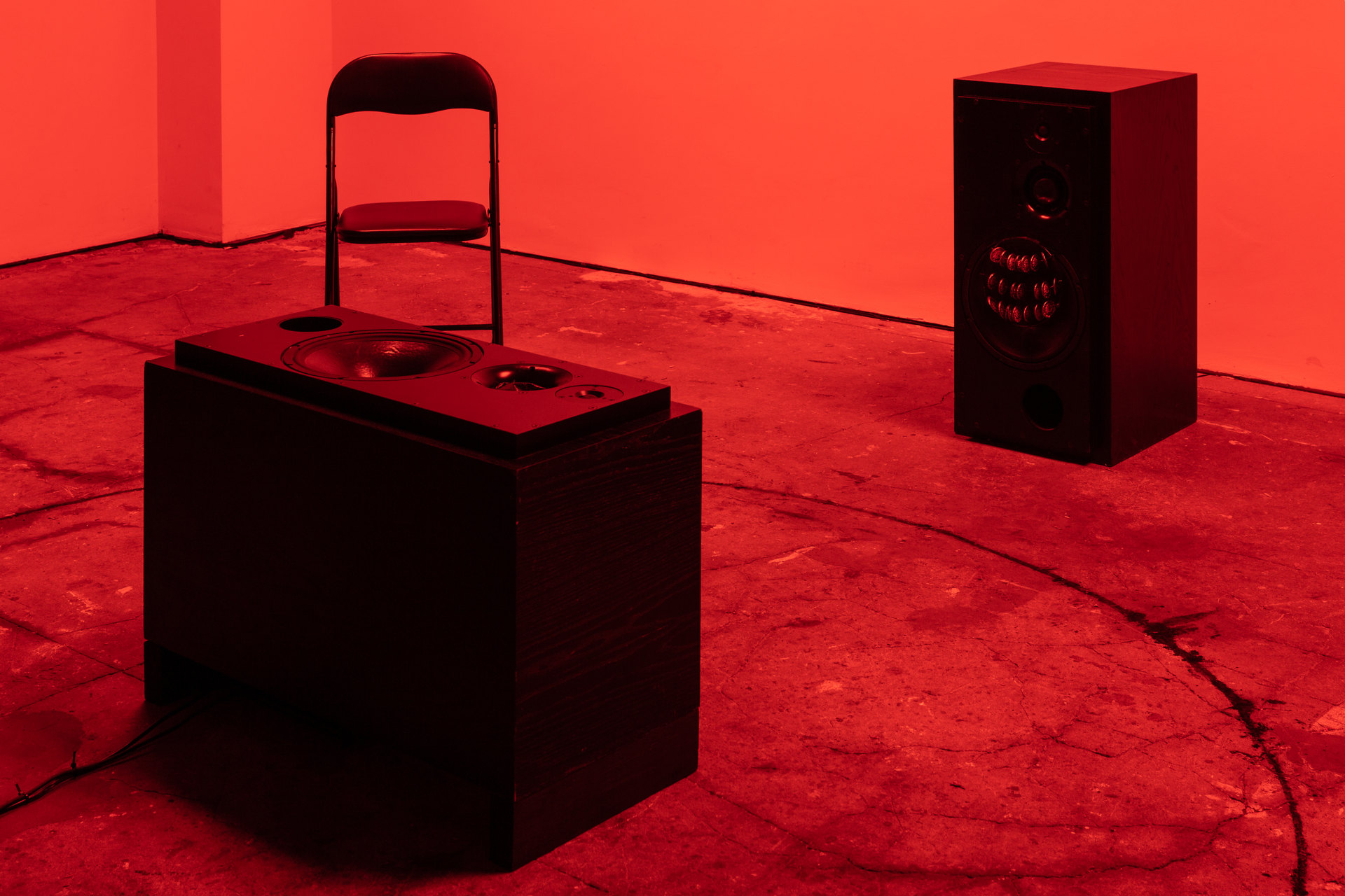 Shenece Oretha, Called To Respond, 2020 Installation View active speakers, charcoal, chicken bones, cymbals, rehearsal chairs, lighting gel