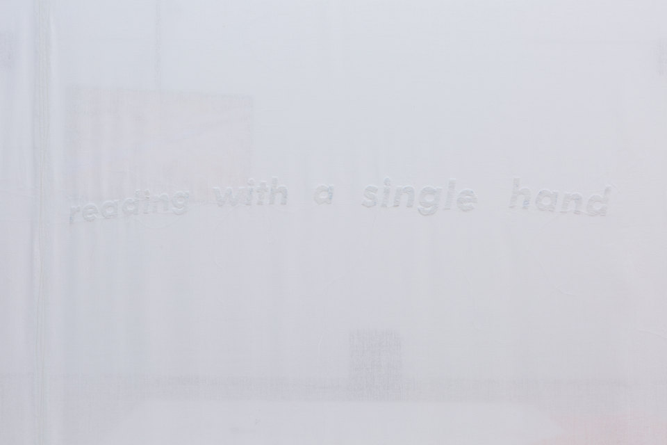 YGRG14X reading with the single hand, 2018, Installation View (Detail) Video, handmade carpet, Conipur Pro clay dust, handmade curtain, chroma sand Dimensions variable