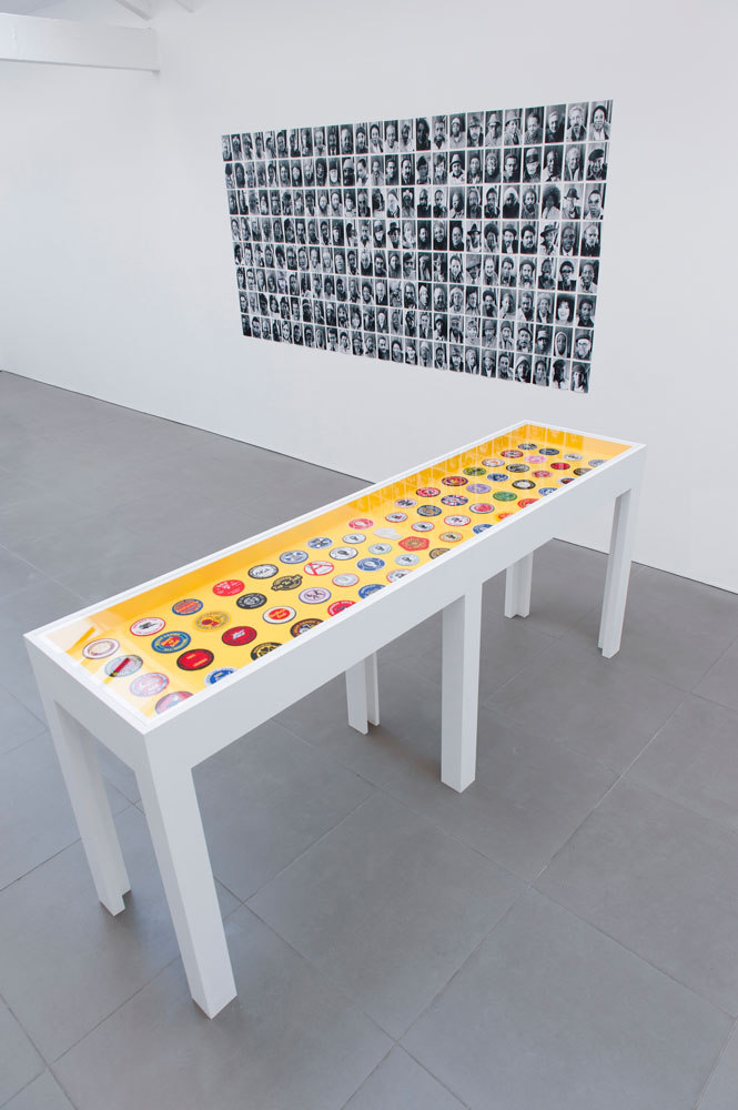 Pre Owned: Looks Good Man, Installation view, 2014 back: Sheldon Nadelman, terminal portraits, 1973 - 82, part of a larger work, photographic inkjet print on paper, 290 x 126 cm, front: Gary Eastwood, Northern Soul Patches, (purchased in 2013), 220 x 95 x 55cm, Cell Projects