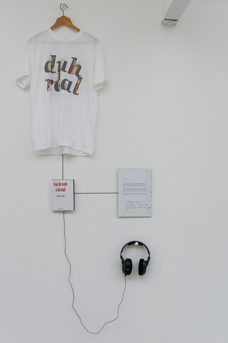 Kathleen Daniel, From the Womb to the Tomb, 2012, mp3 file, duration 51 mins 30 secs, digital print on DVD box cover, digital print on T-shirt, framed letter from the artist to the curator, Cell Project Space