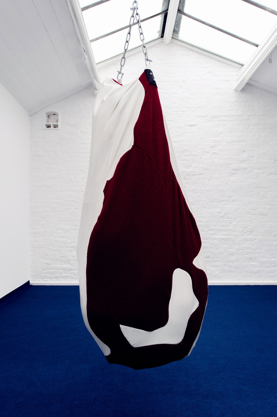 Florian Auer, Not Yet Titled (Punching Bag), 2013, leather cloth, textile, chain (155 x 70 x 35 cm)