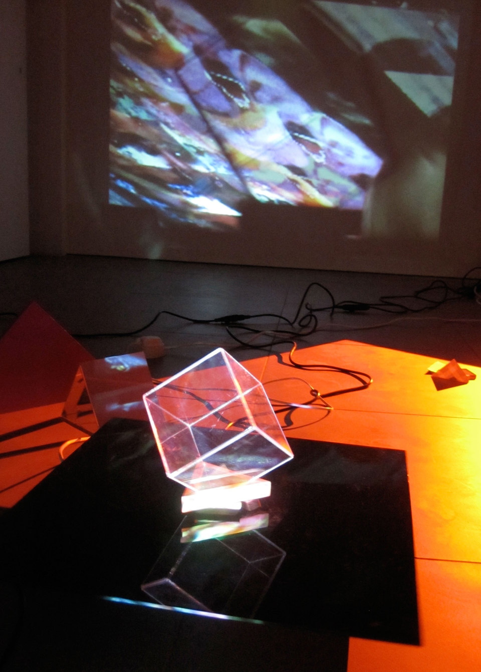 Laura Buckley, Extramundane 2010, Perspex, wood, mirror, motors, music lecterns, 3 video projections, audio (dimensions variable), Cell Project Space