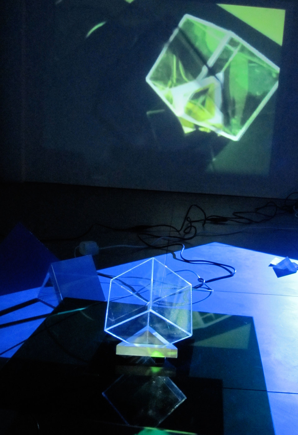 Laura Buckley, Extramundane 2010, Perspex, wood, mirror, motors, music lecterns, 3 video projections, audio (dimensions variable), Cell Project Space