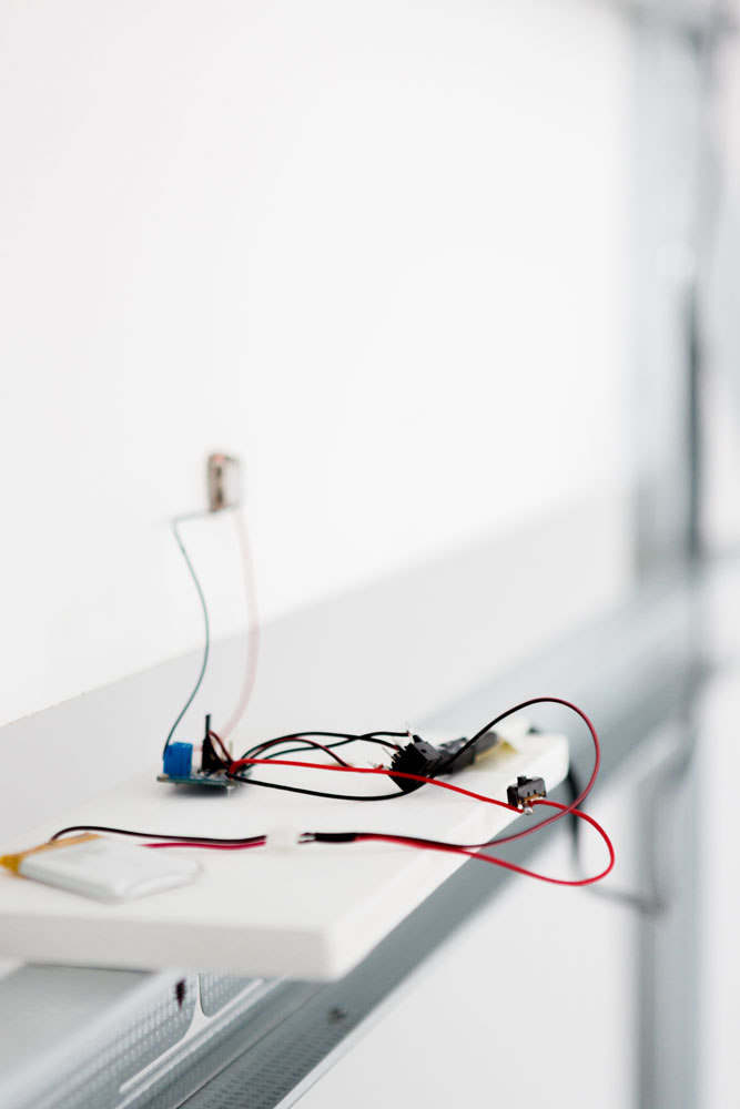 Harry Sanderson, We Are The Human Network (smoke rare-earth petal), three channel video, Amplifier board, Bone Conductor Transducer, 850mAh Lithium Ion Polymer Battery, Stereo Headphone Jack, Slide Switch,  MDF, metal stud, 2015, Cell Project Space